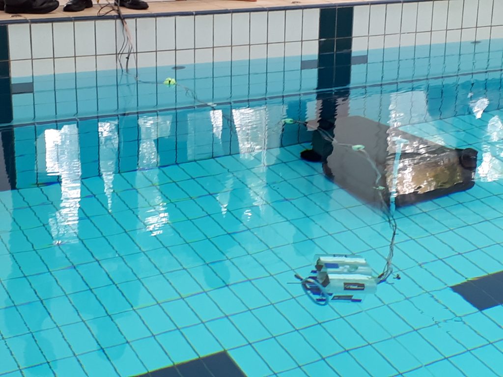 Students with their Remote Operated Underwater Vehicles at the Saints pool