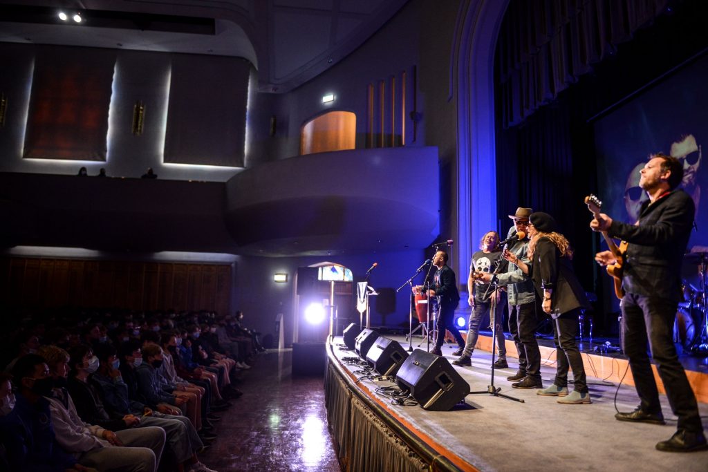 John Brewster and Dave Gleeson from 'The Angels' performing on stage at Battle of the Bands with St Peter's College staff members