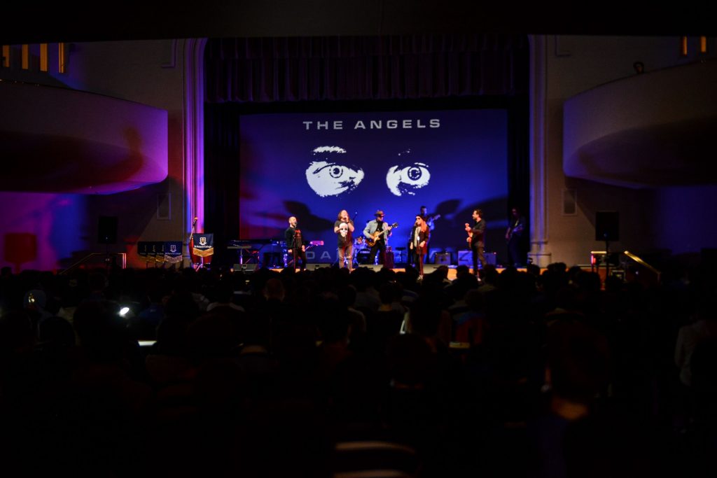 John Brewster and Dave Gleeson from 'The Angels' performing on stage at Battle of the Bands with St Peter's College staff members