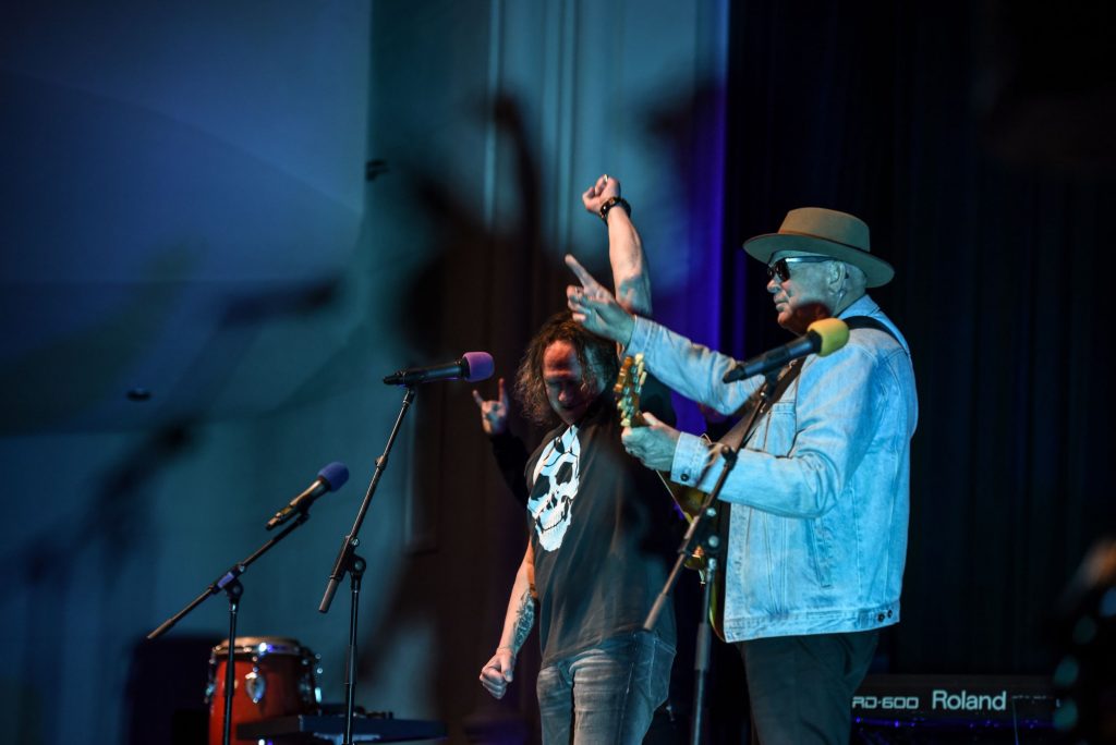 John Brewster and Dave Gleeson from 'The Angels' performing on stage at Battle of the Bands with St Peter's College staff members