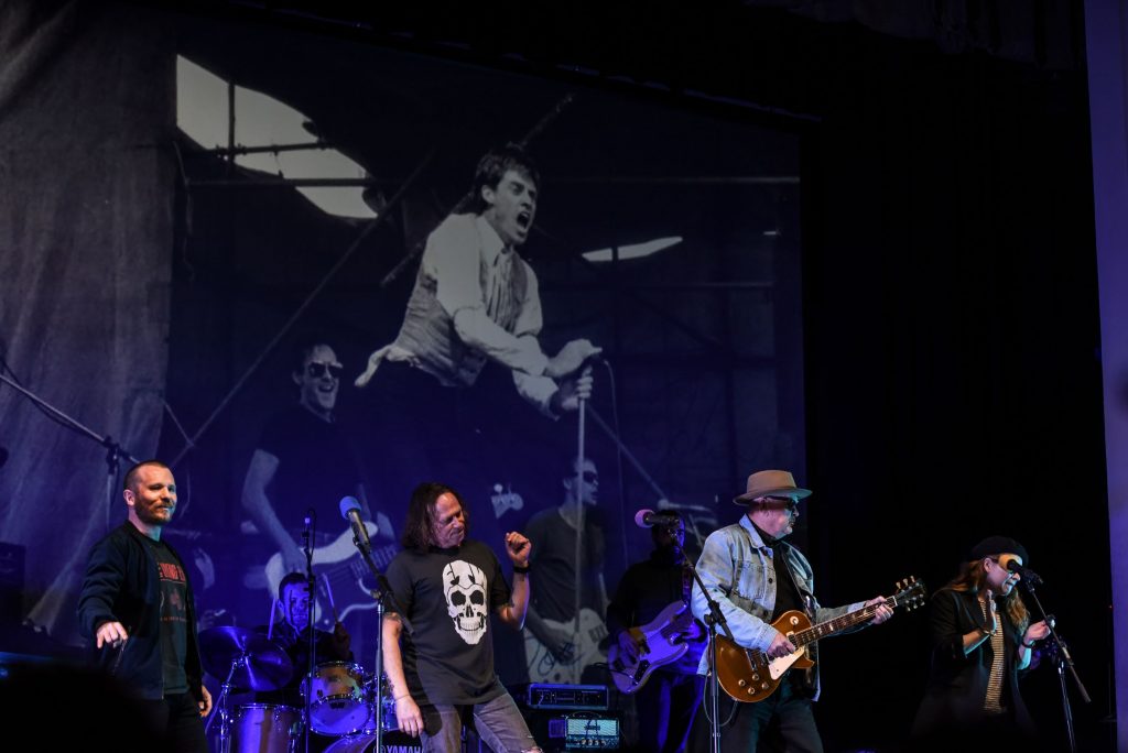 John Brewster and Dave Gleeson from 'The Angels' performing on stage at Battle of the Bands with St Peter's College staff members